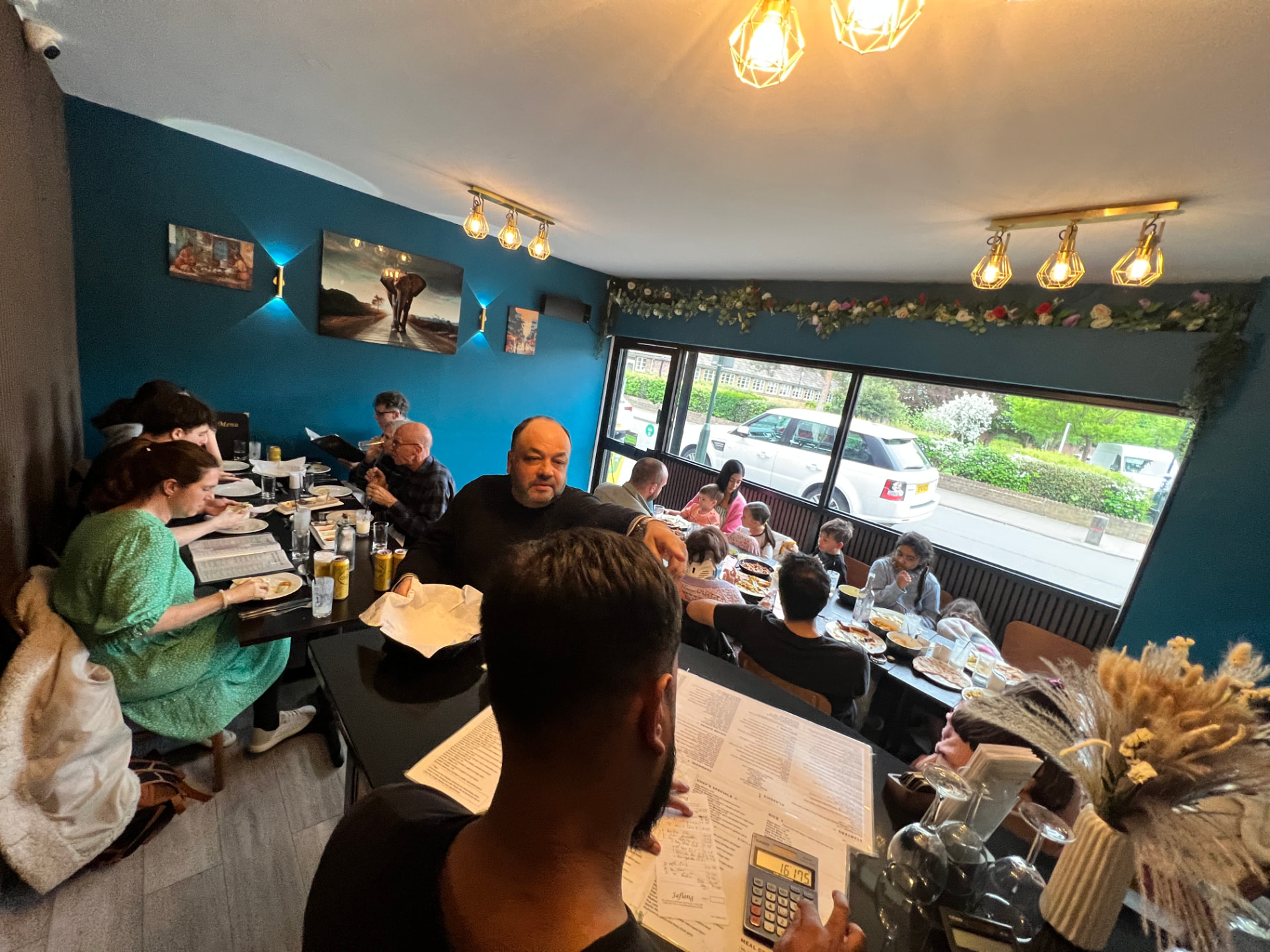 Families sharing a meal in the Jaflong Tandoori dining room